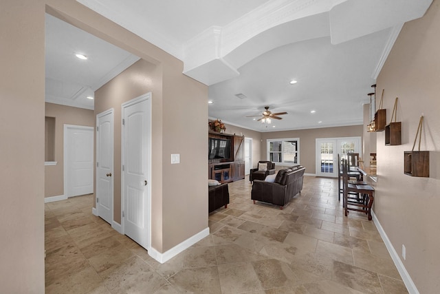 living room featuring crown molding and ceiling fan