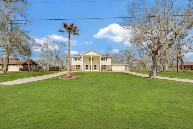 view of front of home with a garage and a front yard