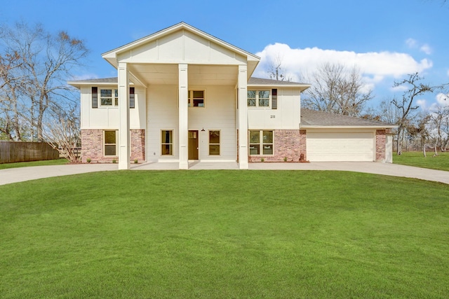 view of front of home featuring a garage and a front yard