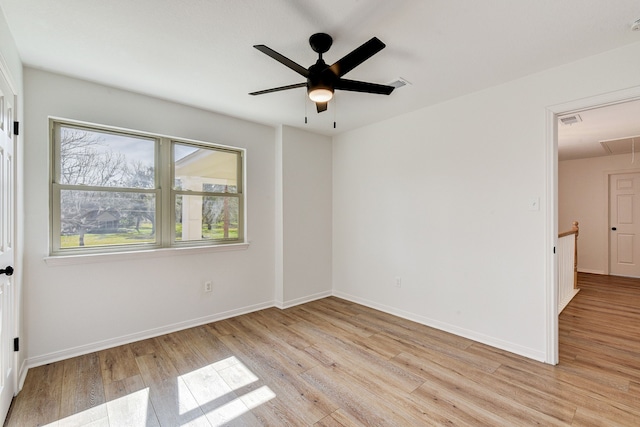 unfurnished room with ceiling fan and light hardwood / wood-style floors