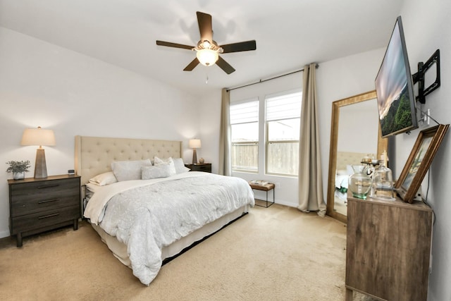 bedroom featuring light colored carpet and ceiling fan