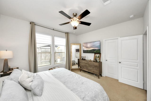 carpeted bedroom with ceiling fan