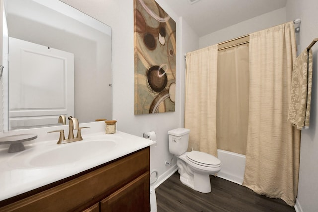 full bathroom featuring vanity, shower / tub combo, wood-type flooring, and toilet