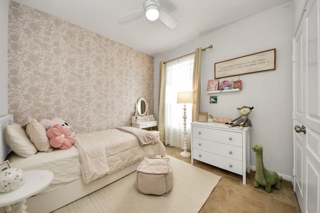 bedroom featuring light carpet and ceiling fan