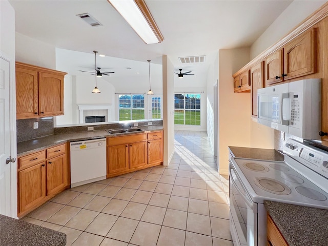 kitchen featuring white appliances, decorative backsplash, ceiling fan, and light tile patterned flooring