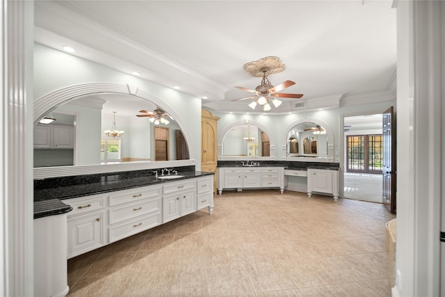 bathroom with vanity, crown molding, and ceiling fan with notable chandelier