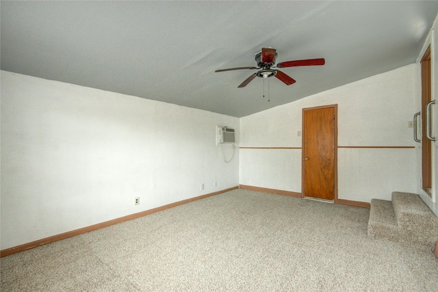 spare room with lofted ceiling, a wall mounted air conditioner, carpet, and ceiling fan