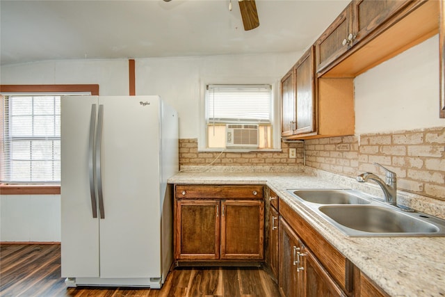 kitchen featuring sink, dark wood-type flooring, cooling unit, white refrigerator, and tasteful backsplash