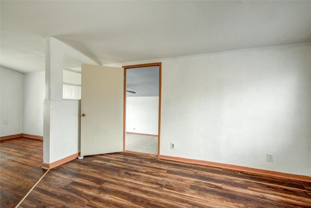 spare room with dark wood-type flooring