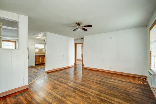 unfurnished room featuring ceiling fan and dark hardwood / wood-style flooring