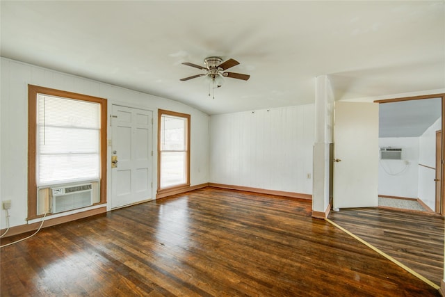 interior space featuring cooling unit, ceiling fan, dark hardwood / wood-style flooring, and an AC wall unit