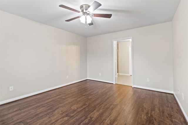 unfurnished room featuring dark hardwood / wood-style floors and ceiling fan