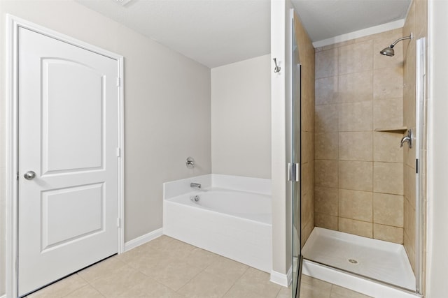 bathroom with separate shower and tub and tile patterned flooring