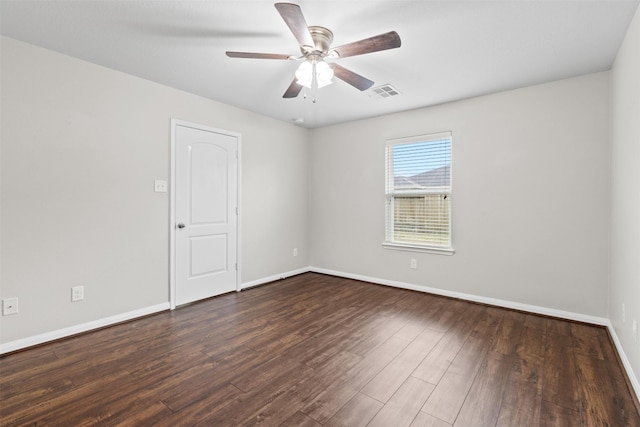 unfurnished room featuring dark hardwood / wood-style floors and ceiling fan