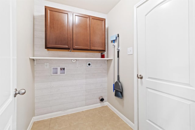 laundry room featuring washer hookup, light tile patterned floors, cabinets, and hookup for an electric dryer