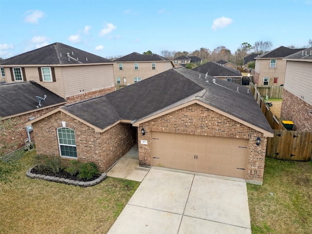 view of front of home with a garage and a front yard