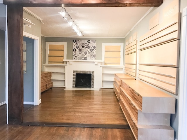 1632 W Alabama St, Houston, TX 77006 - unfurnished living room featuring wood finished floors, a tiled fireplace, and ornamental molding