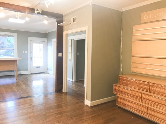 1632 W Alabama St, Houston, TX 77006 - interior space featuring visible vents, ornamental molding, dark wood-style floors, and baseboards