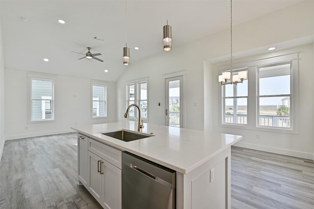 kitchen with sink, decorative light fixtures, dishwasher, an island with sink, and white cabinets