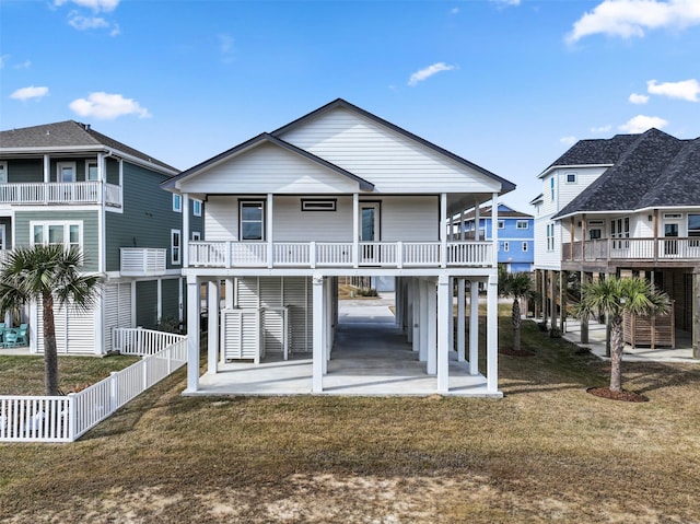 back of house featuring a carport and covered porch