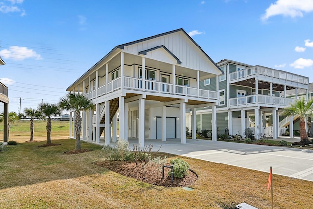 view of front of house with a carport, covered porch, and a front yard