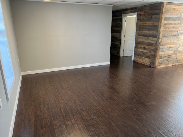 spare room with dark hardwood / wood-style flooring