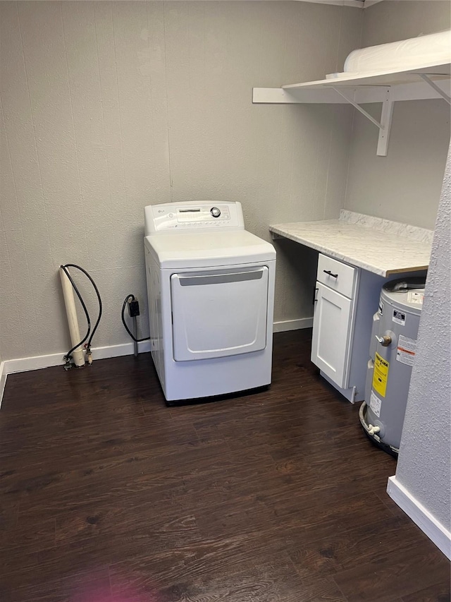 laundry area featuring dark hardwood / wood-style flooring, washer / clothes dryer, cabinets, and water heater