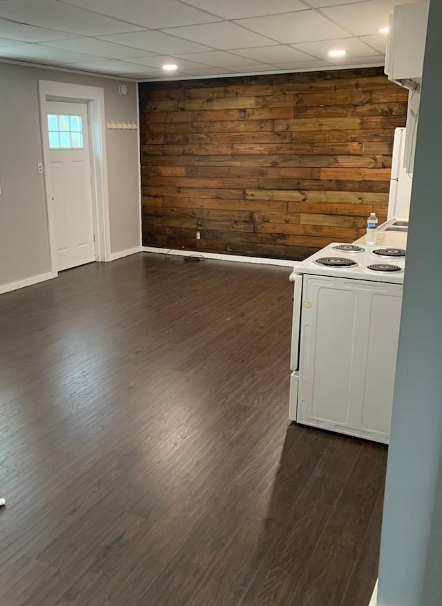 interior space featuring dark hardwood / wood-style flooring and wood walls