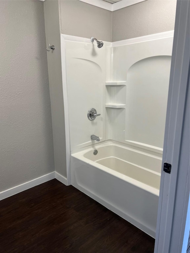 bathroom featuring shower / bath combination and hardwood / wood-style floors