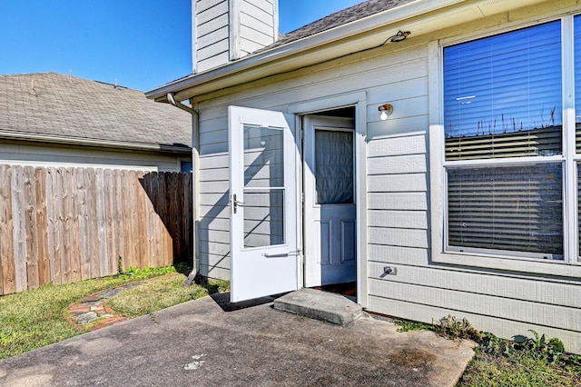 property entrance featuring a patio