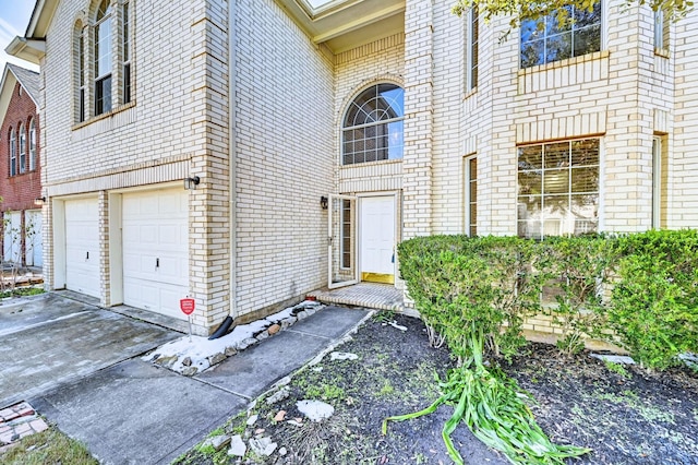 doorway to property featuring a garage