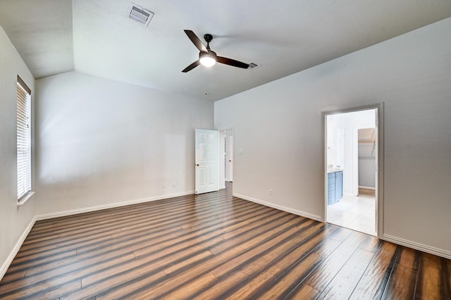 interior space with ceiling fan, wood-type flooring, and lofted ceiling