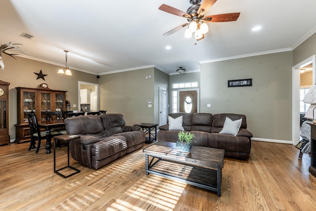 living room featuring crown molding, ceiling fan, and light hardwood / wood-style flooring