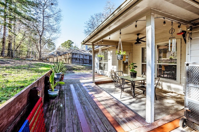 wooden terrace featuring ceiling fan