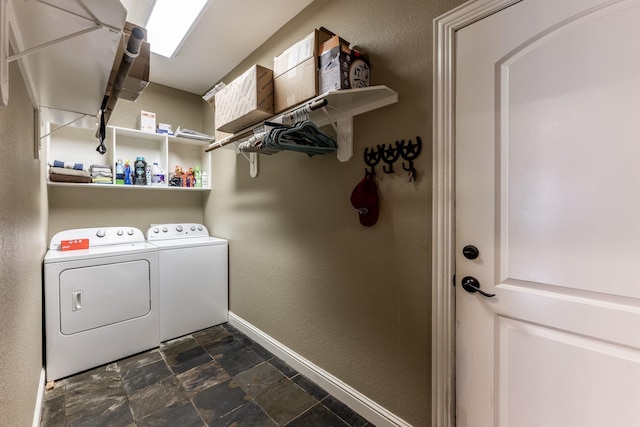 washroom featuring washing machine and clothes dryer