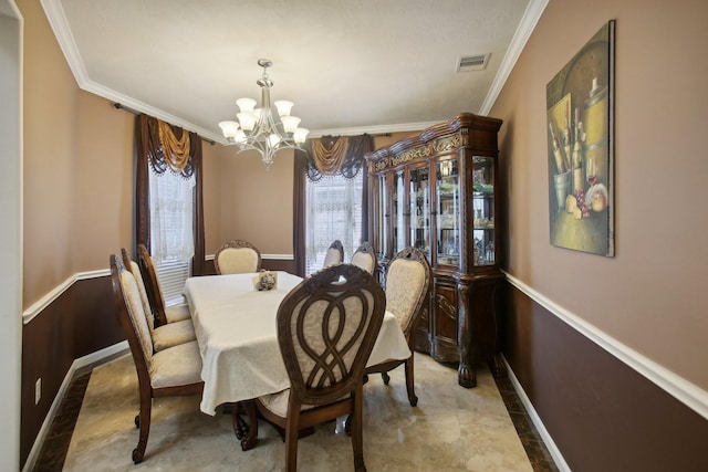 dining area with ornamental molding, wooden walls, and a chandelier