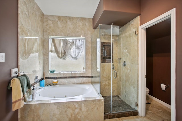 bathroom featuring shower with separate bathtub and toilet