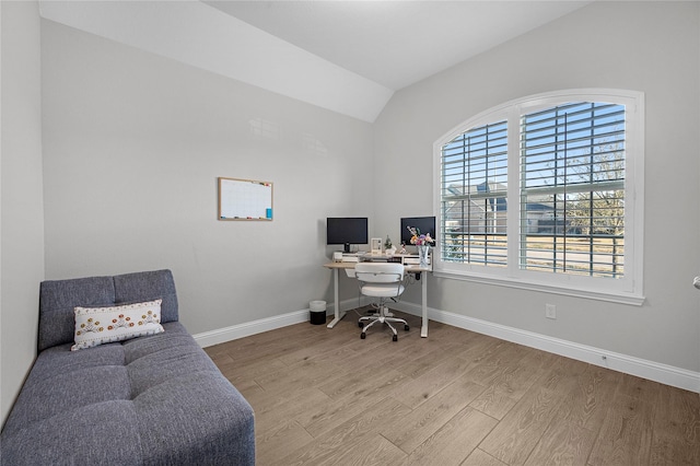 office area featuring lofted ceiling and light wood-type flooring