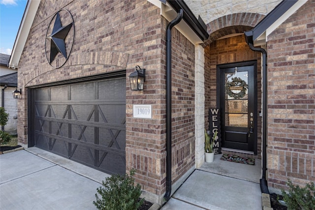 doorway to property featuring a garage