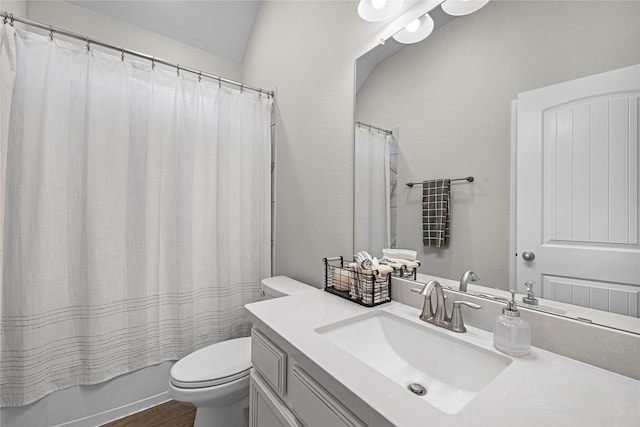 full bathroom featuring hardwood / wood-style flooring, vanity, toilet, and shower / bath combo