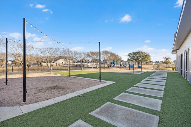 view of community featuring a playground and a lawn