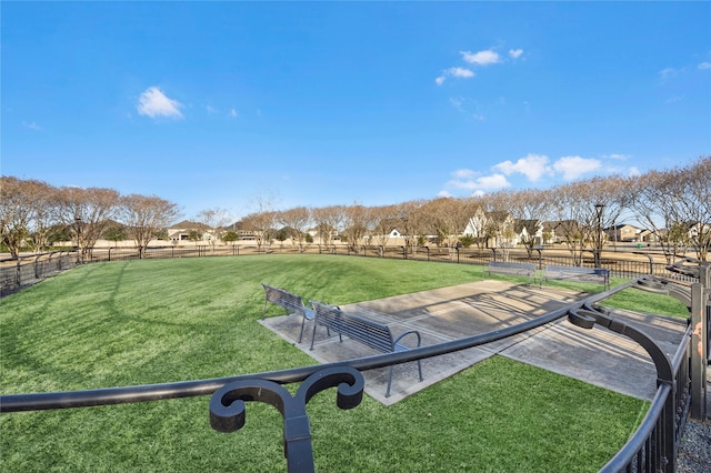 view of property's community with a lawn