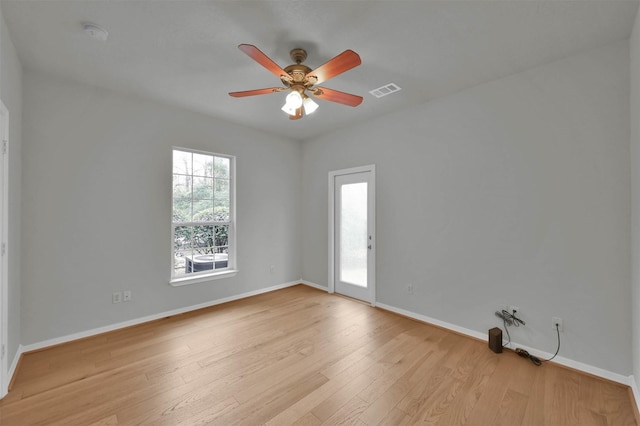 empty room featuring ceiling fan and light wood-type flooring