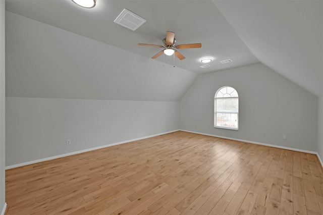 additional living space featuring ceiling fan, lofted ceiling, and light wood-type flooring