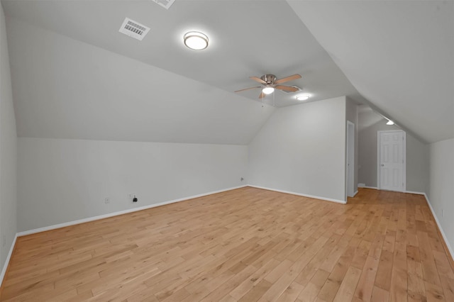 bonus room with ceiling fan, lofted ceiling, and light hardwood / wood-style flooring
