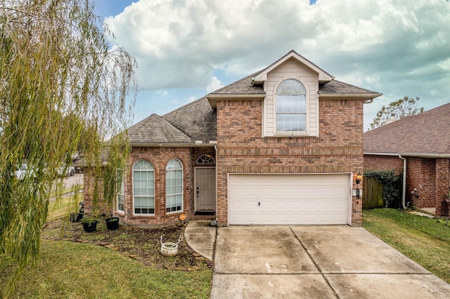 view of front of property featuring a garage and a front yard