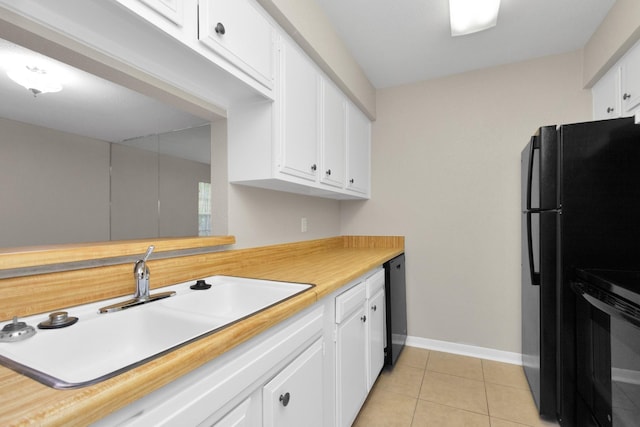 kitchen with white cabinetry, light tile patterned flooring, sink, and black appliances