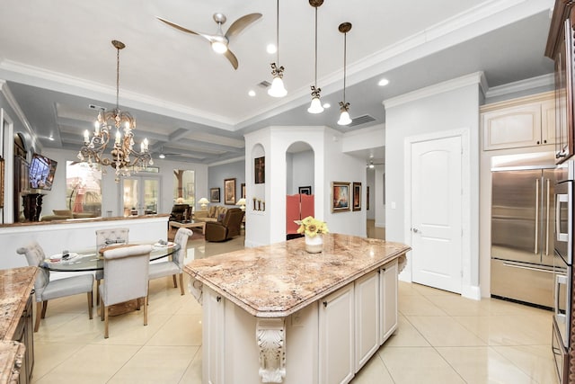 kitchen featuring stainless steel built in refrigerator, a kitchen island, pendant lighting, and light tile patterned flooring