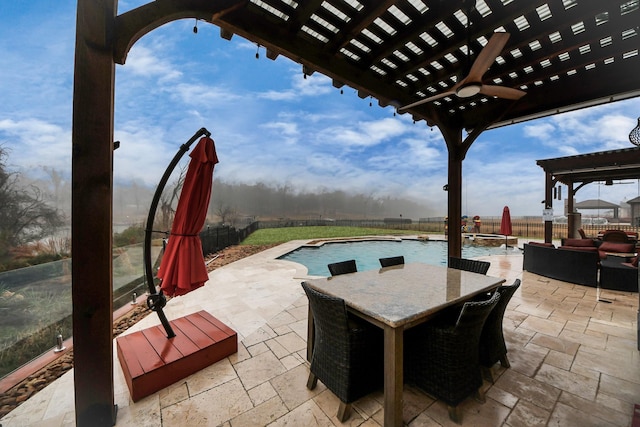 view of patio featuring a fenced in pool, a water view, and ceiling fan