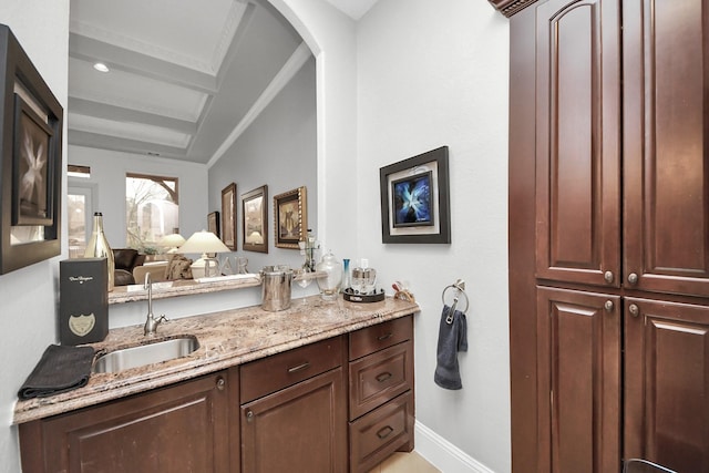 bathroom featuring vanity and beam ceiling